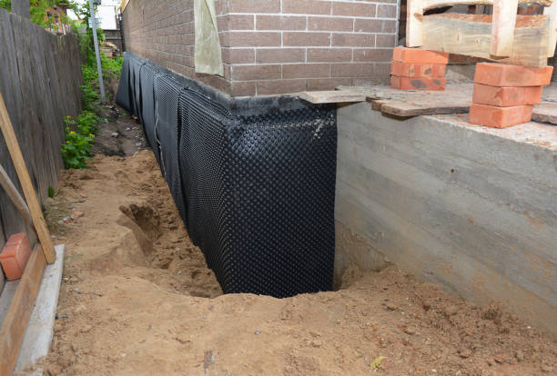 Happy homeowners after waterproofing job in Lorton
